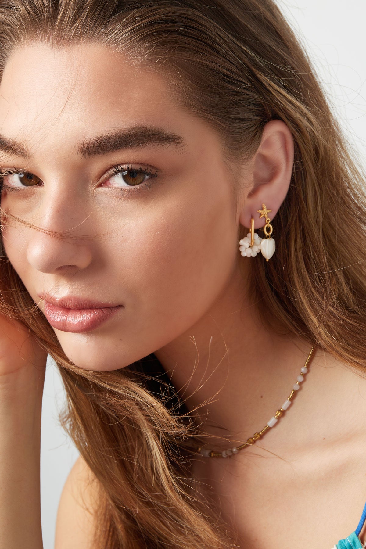 Oorbellen met schelp bloem - goud RVS