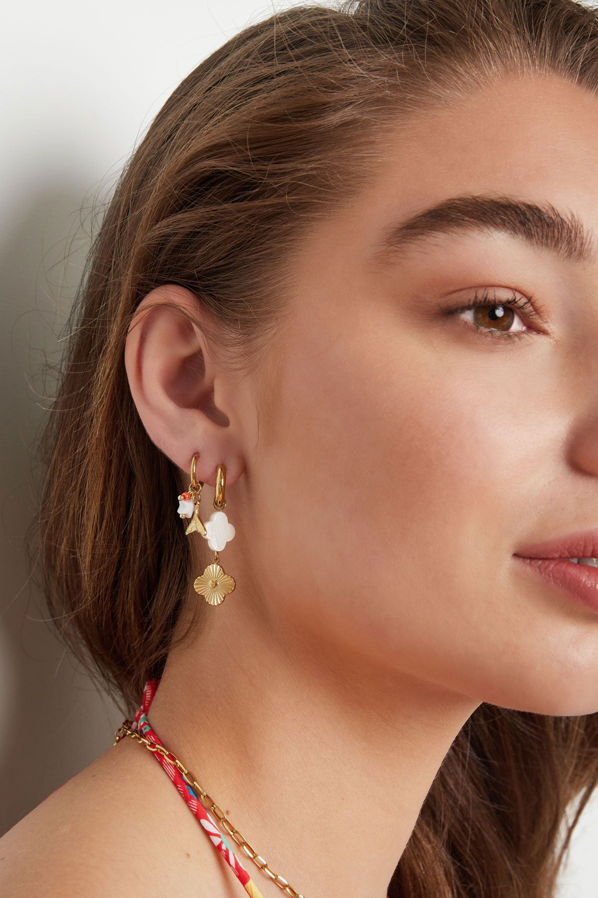 Oorbellen met bedel party - goud RVS