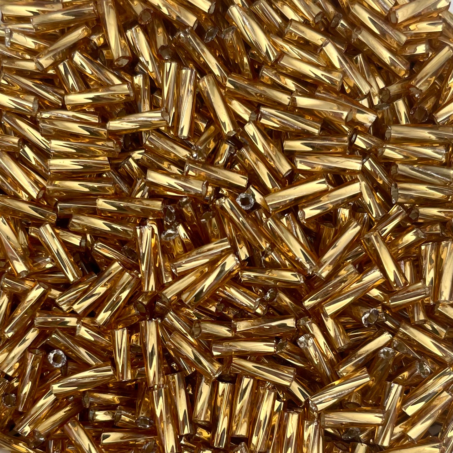 5gram Rocailles Bugles twist geel goud - 6mm